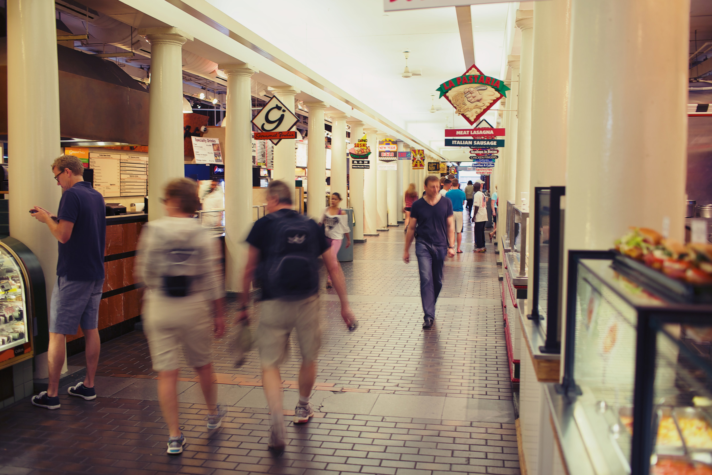 People walking through a market in Boston
