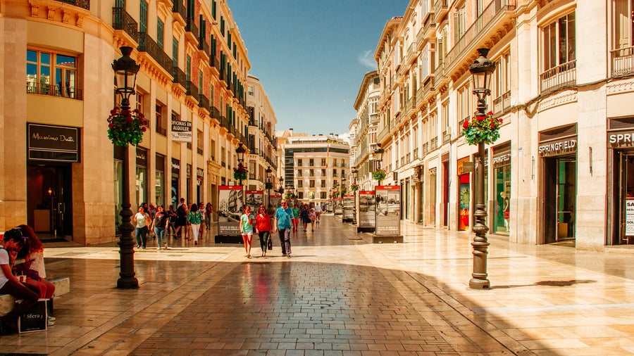 City center of Málaga, Spain, featuring bustling streets with famous stores and historic architecture
