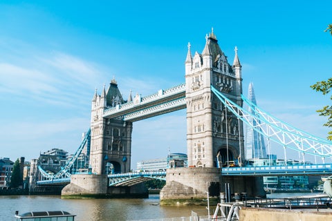 Tower Bridge viewed from the River Thames on a sunny day with The Shard and modern buildings in the background