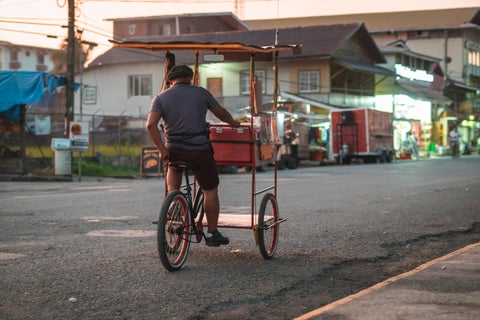 Local street vendor selling goods in the colourful streets of Bocas del Toro, Panama