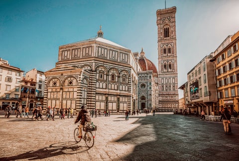 Piazza del Duomo in Florence featuring Cathedral (Duomo) with its iconic red dome, the intricate marble facade of the Baptistery of St. John