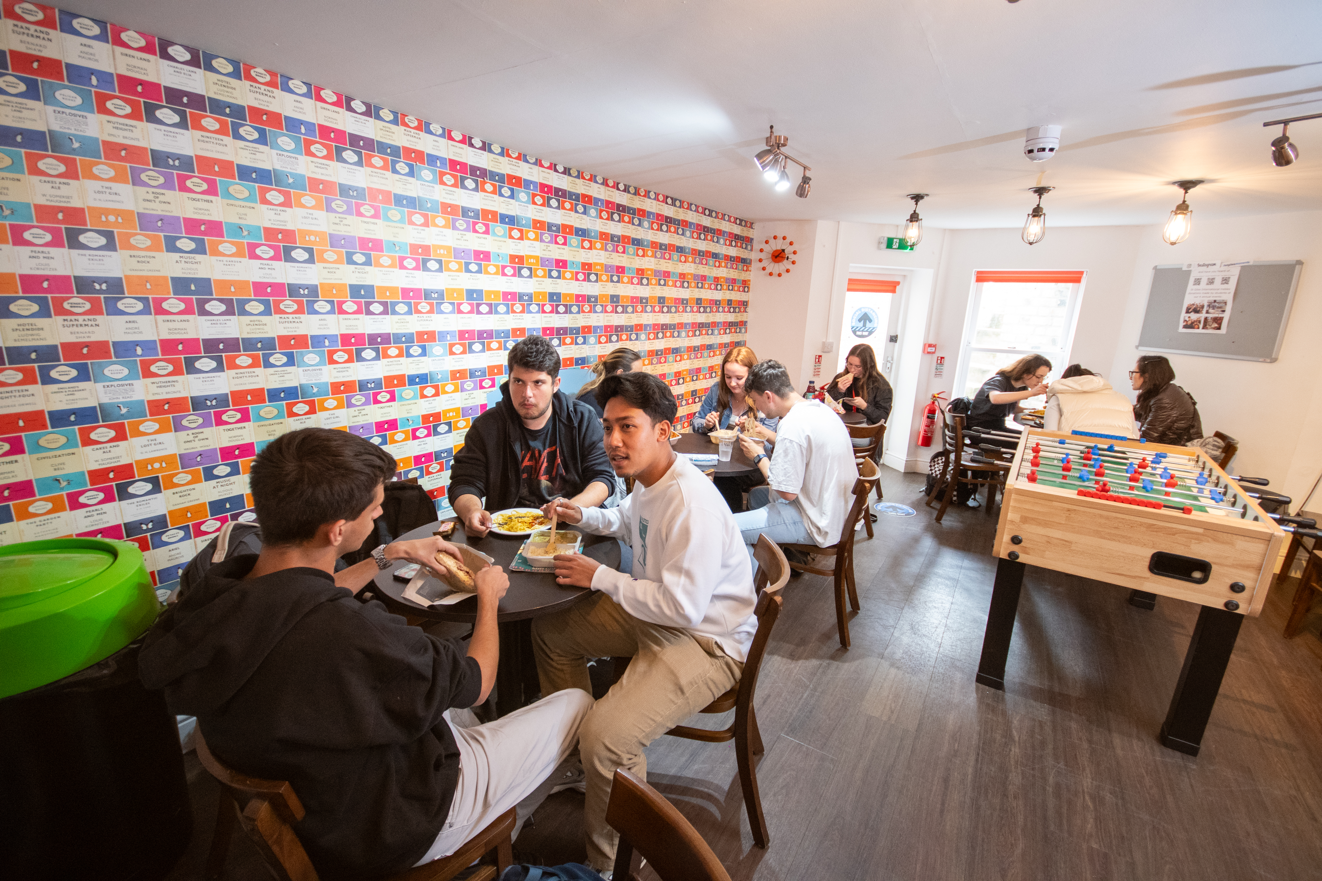 A group of students sitting in the common room at the Cambridge College Programme
