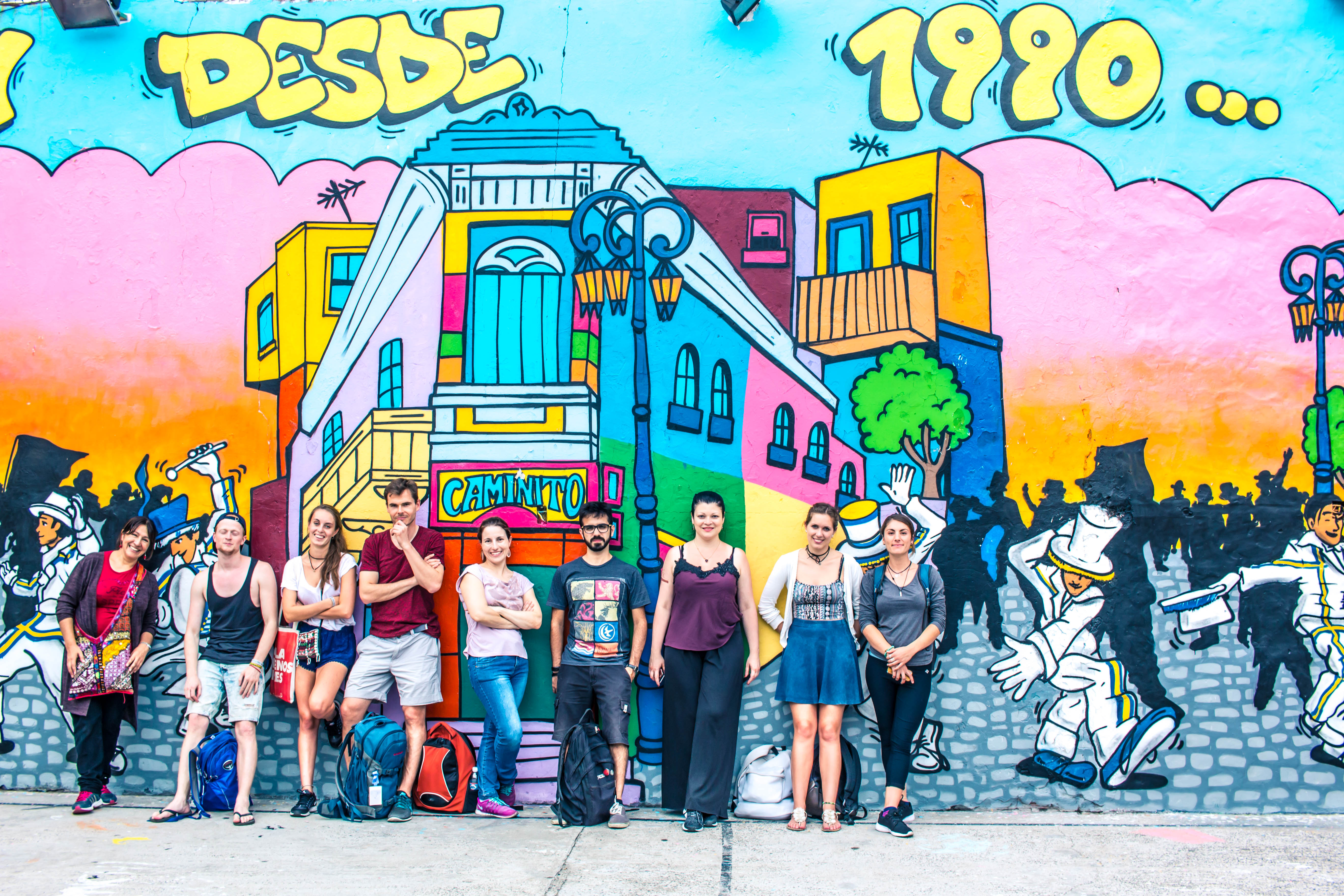 A group of students in front of a mural in Buenos Aires