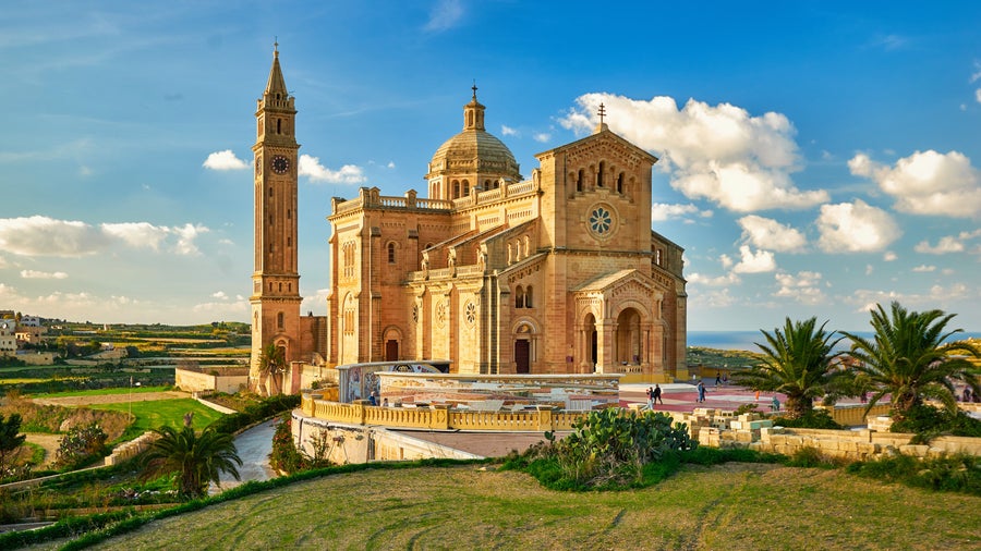 Church of Our Lady of Lourdes in Mgarr, Gozo, Malta with Gothic architecture overlooking Mgarr Harbour