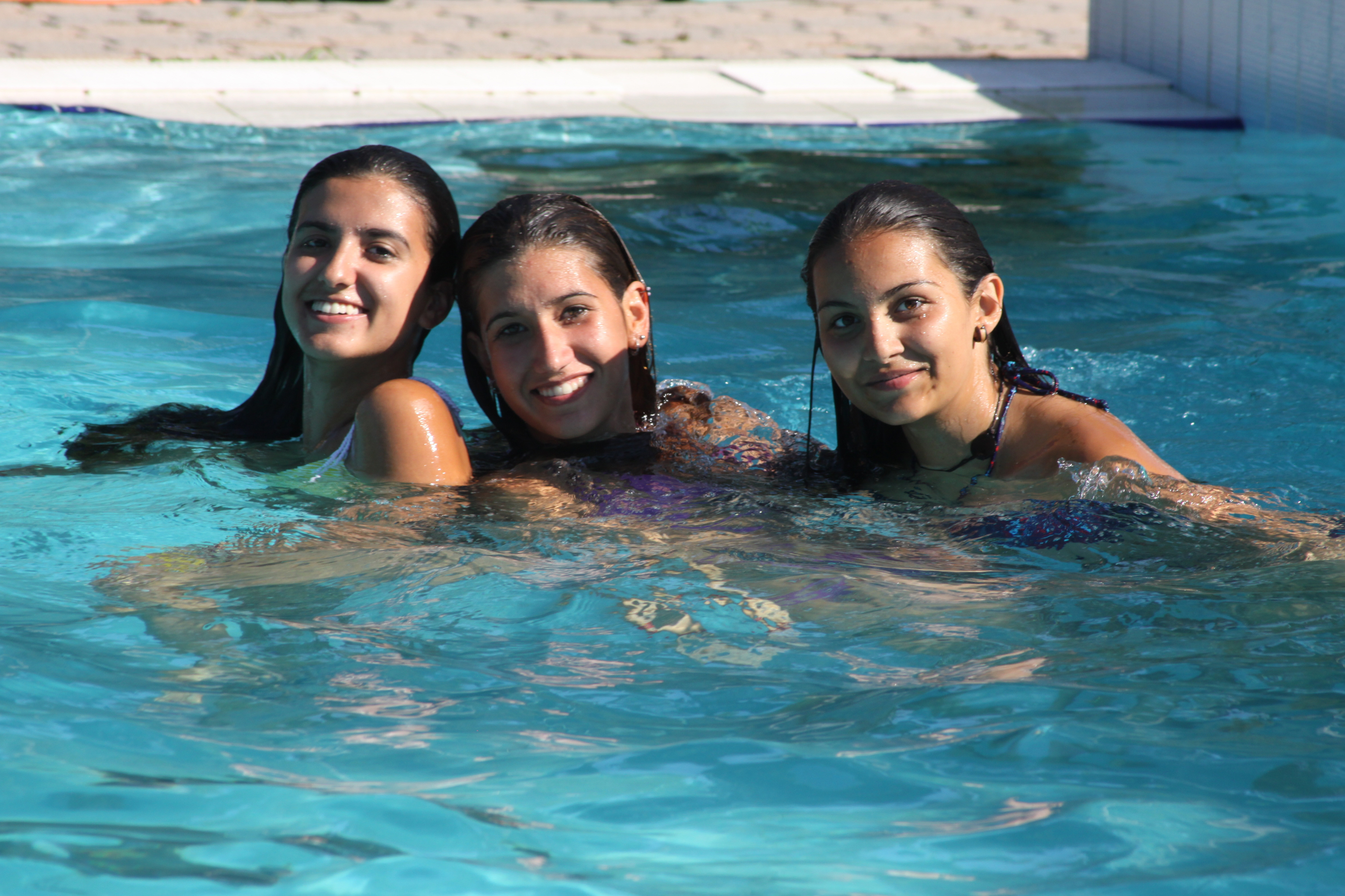 Three students in the swimming pool