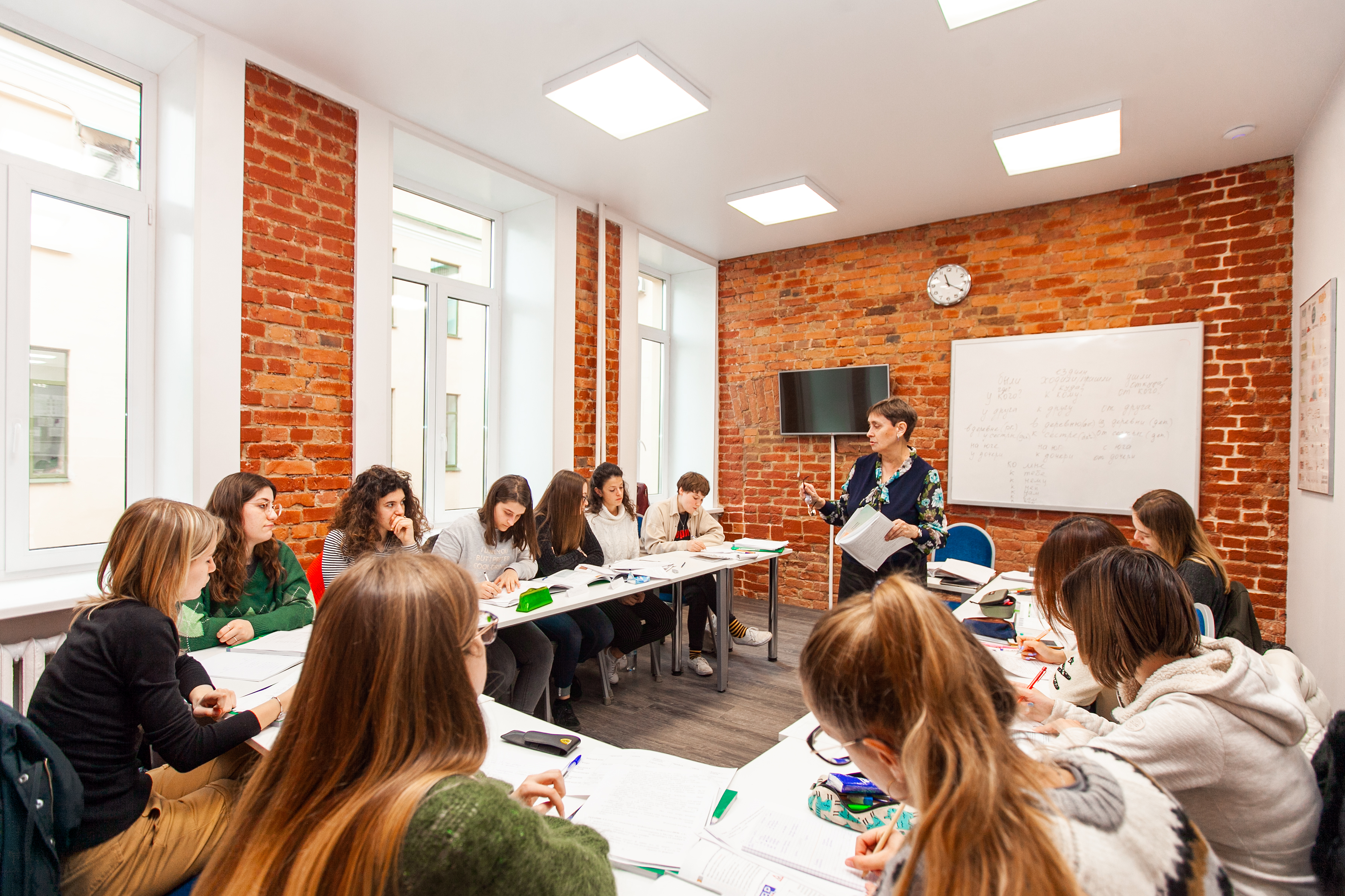 A teacher explaining a lesson to her students