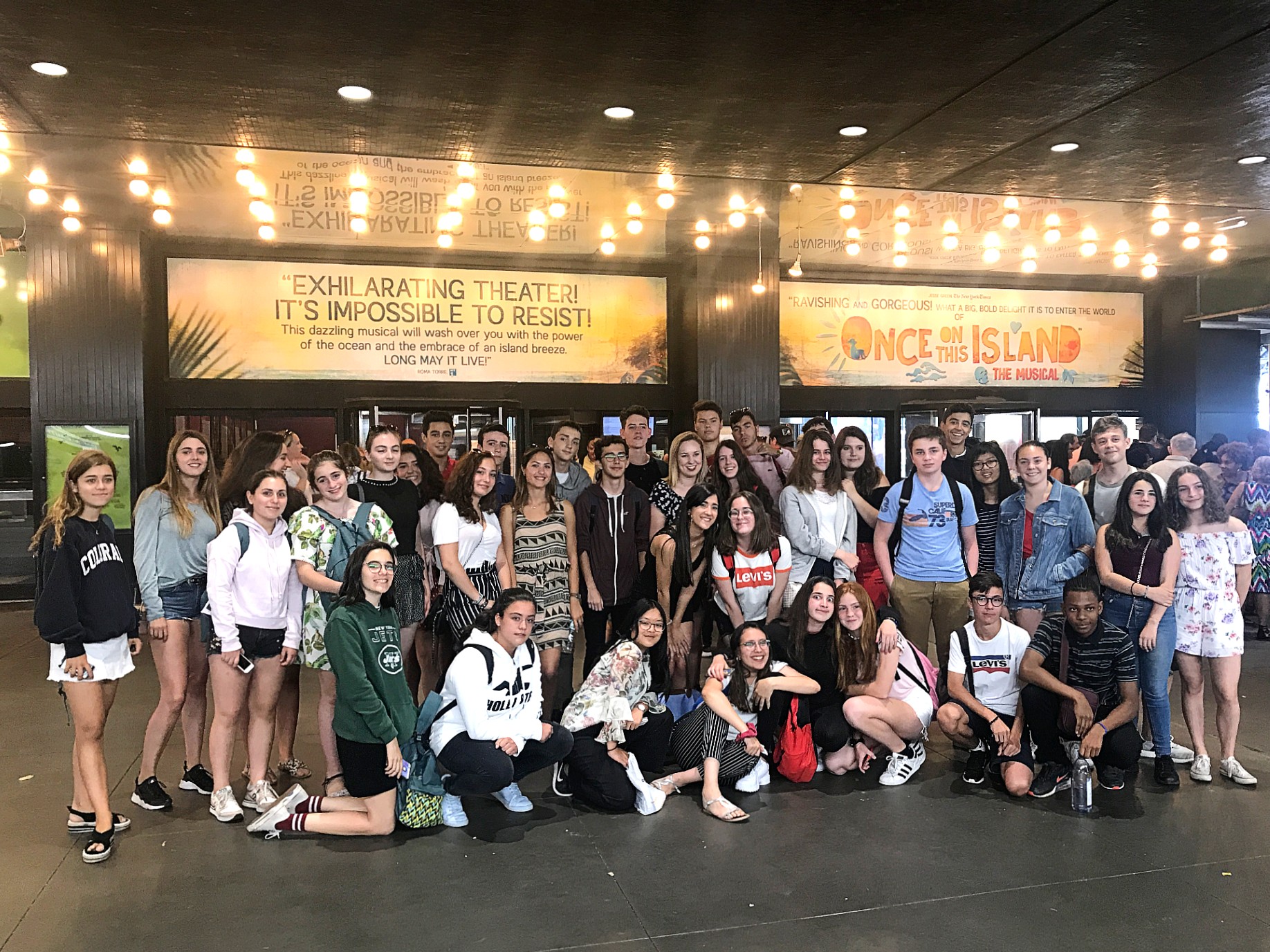 A group of students in front of a theatre in Broadway