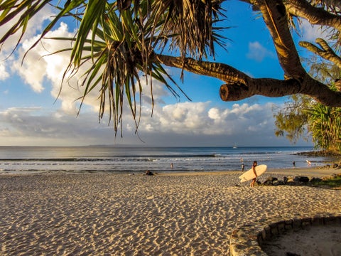 Noosa Beach white-sand with surfers, Queensland, Australia