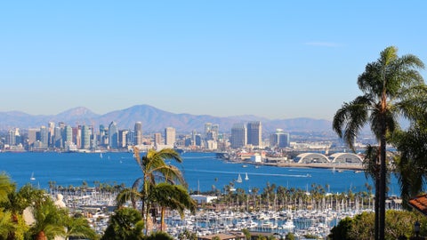 Aerial view of downtown San Diego with coastline, harbour, and cityscape under a clear blue sky