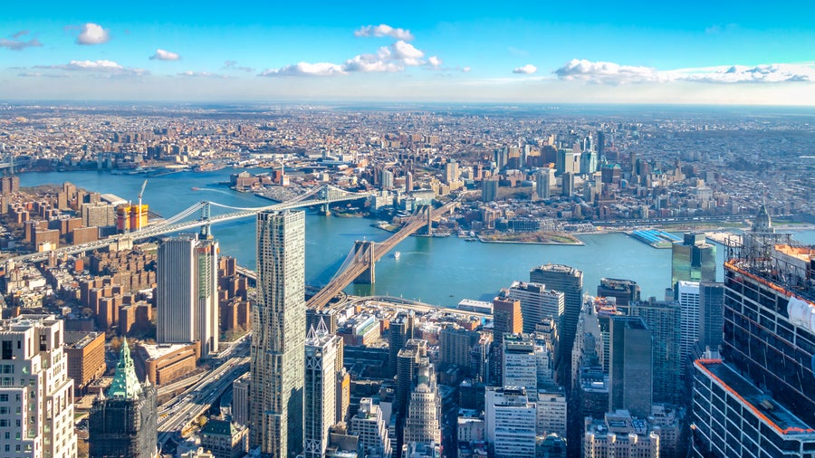 Aerial view of New York city, Manhattan and its modern skyscrapers, Hudson River and Brooklyn Bridge