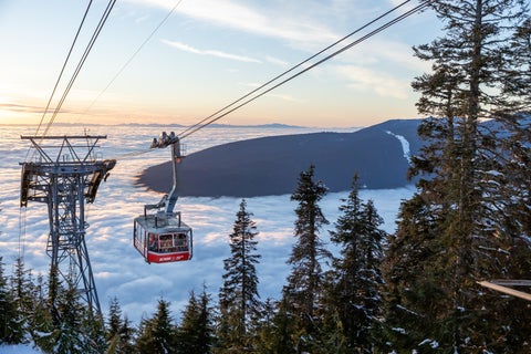 A view of Skyride Gondola at The Peak of Vancouver inside the Grouse Mountain Ski Resort during at sunset