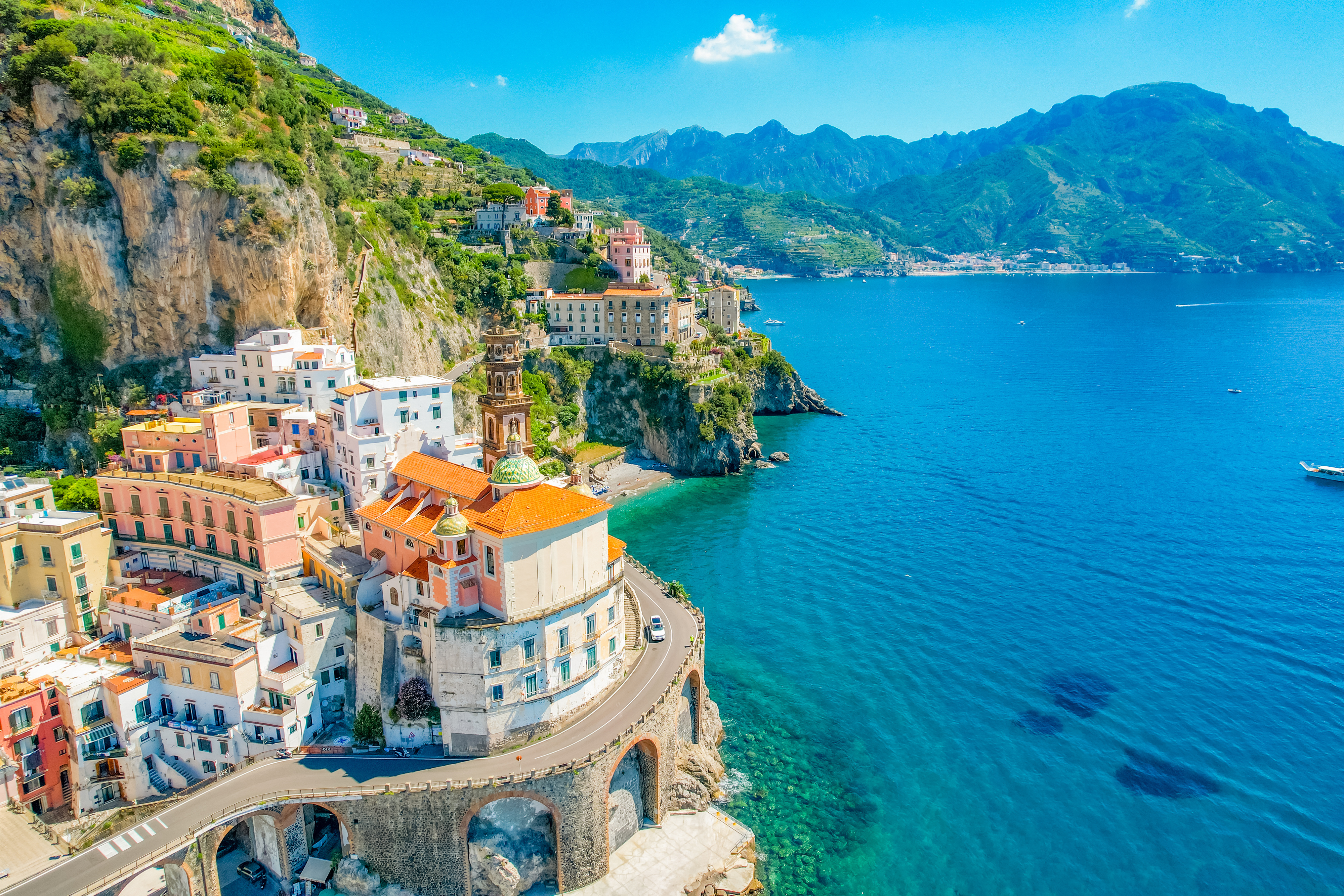 Aerial view of Salerno, Italy, featuring the seaside and rolling hills in the background