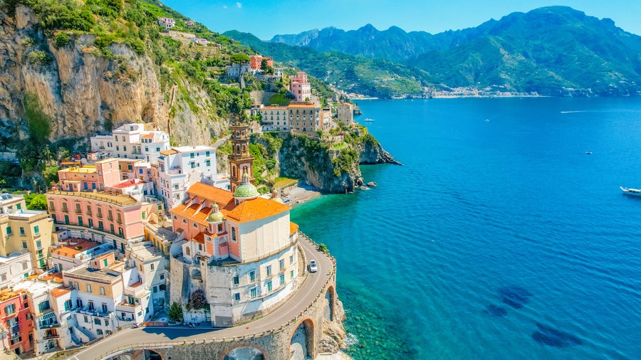 Aerial view of Salerno, Italy, featuring the seaside and rolling hills in the background
