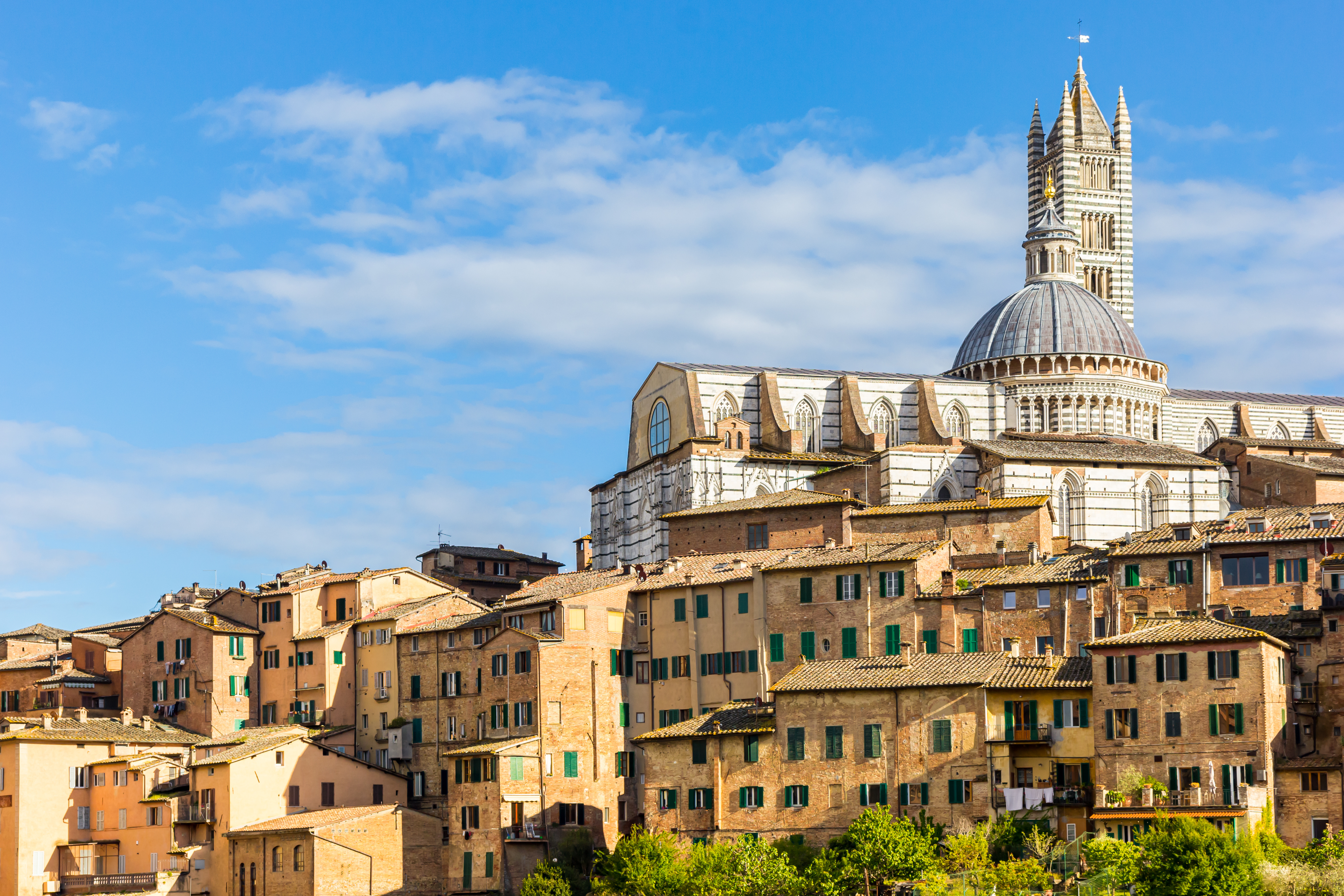 Aerial view of Siena Historic City Center featuring Siena Cathedral (Duomo di Siena) in Italy