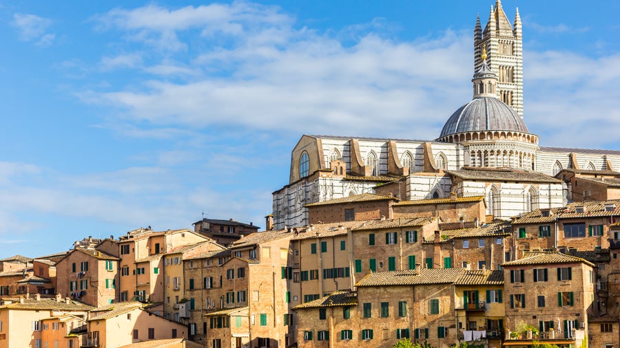 Aerial view of Siena Historic City Center featuring Siena Cathedral (Duomo di Siena) in Italy