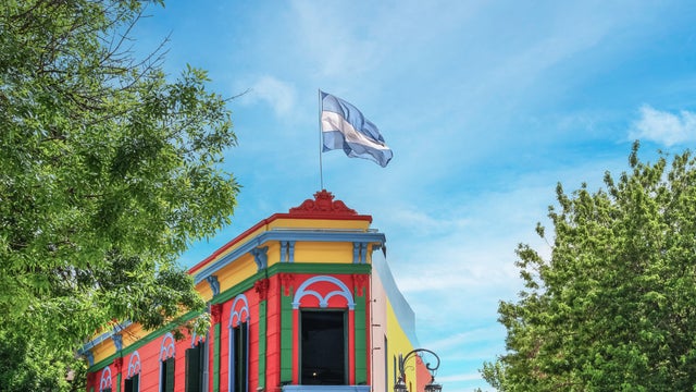 Brightly painted house in La Boca, Buenos Aires, showcasing vibrant blues, reds, and yellows