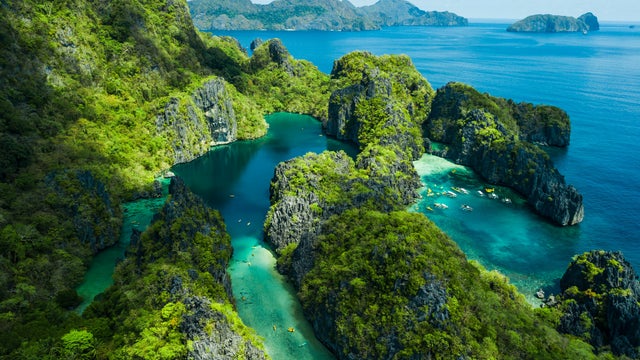 Aerial view of El Nido, Palawan, Philippines, featuring Big Lagoon, Small Lagoon, and towering limestone cliffs