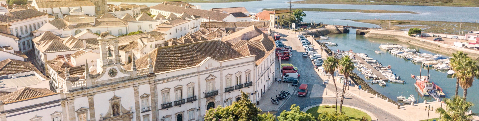 Aerial view of Faro, Portugal, showing the Old Town (Cidade Velha), Arco da Vila, Faro Marina, and Ria Formosa Natural Park
