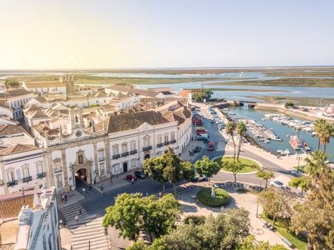 Aerial view of Faro, Portugal, showing the Old Town (Cidade Velha), Arco da Vila, Faro Marina, and Ria Formosa Natural Park