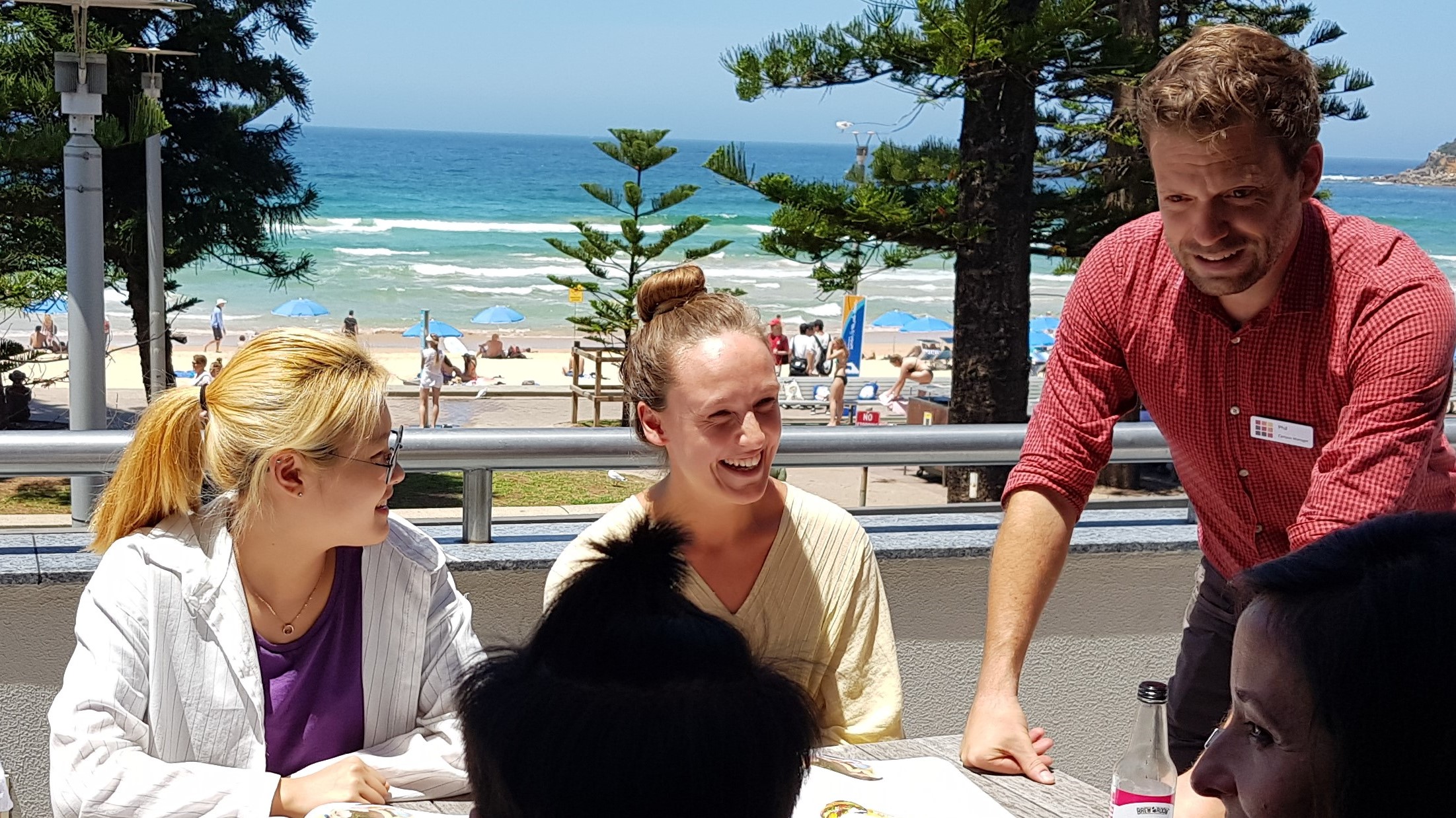 A teacher with his students at Lexis Sydney