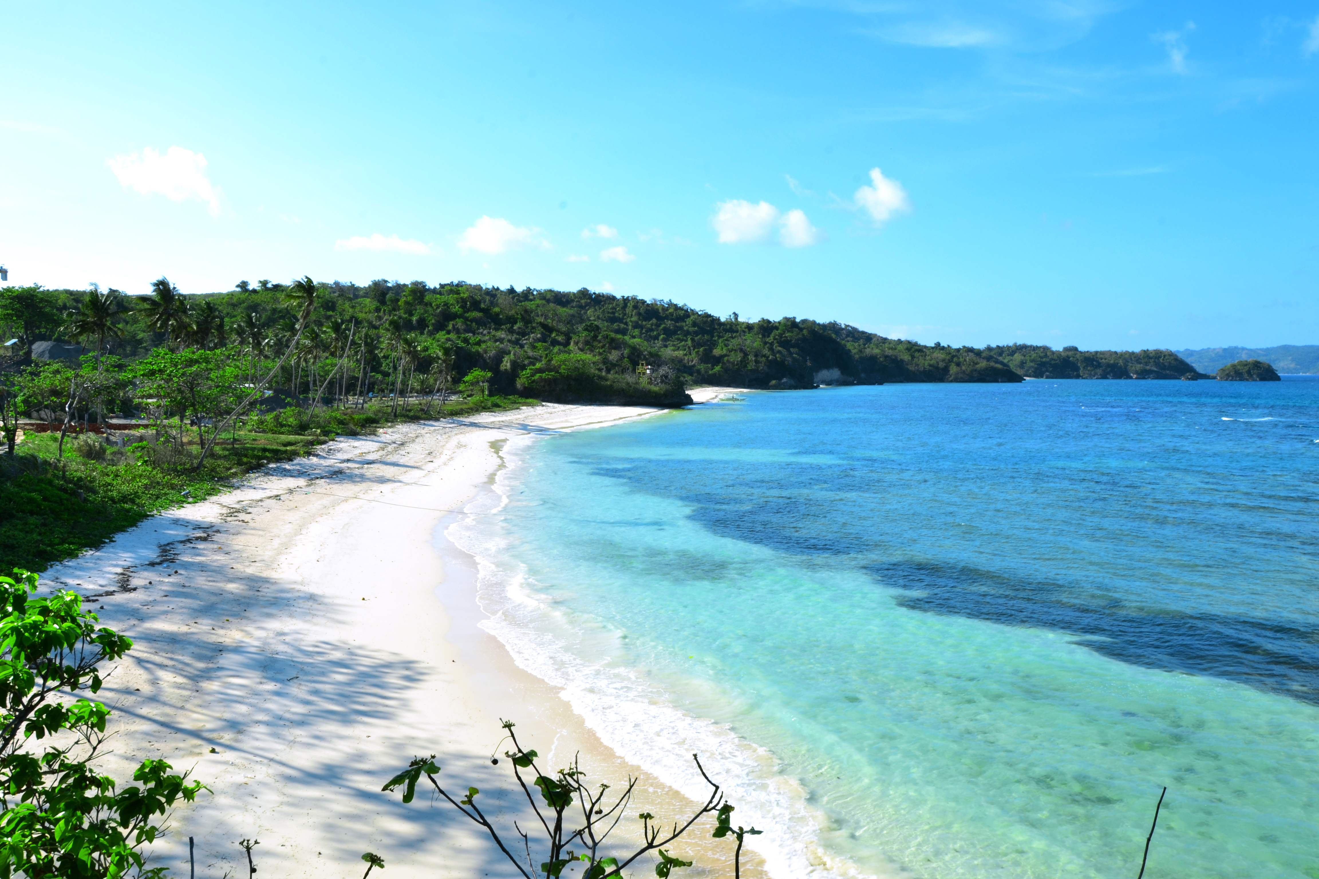Ilig Iligan Beach on Boracay Island, Philippines, with white sand and clear turquoise waters