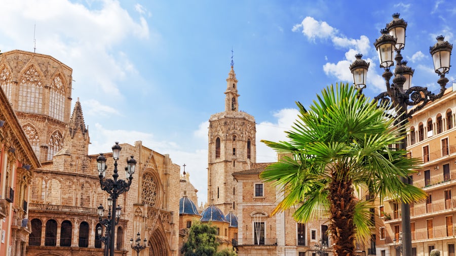 Plaza de la Virgen in Valencia, Spain, featuring the Basilica of the Virgin of the Forsaken, Valencia Cathedral, and the Palau de la Generalitat Valenciana