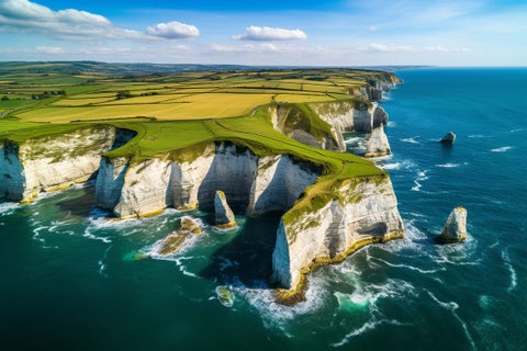 Aerial view of the Cliffs of Moher in Ireland, beautiful blue ocean and green grassy fields