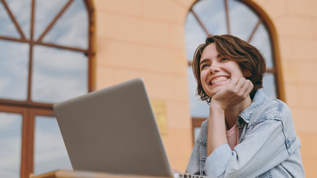 Girl using her laptop to take a remote online French course