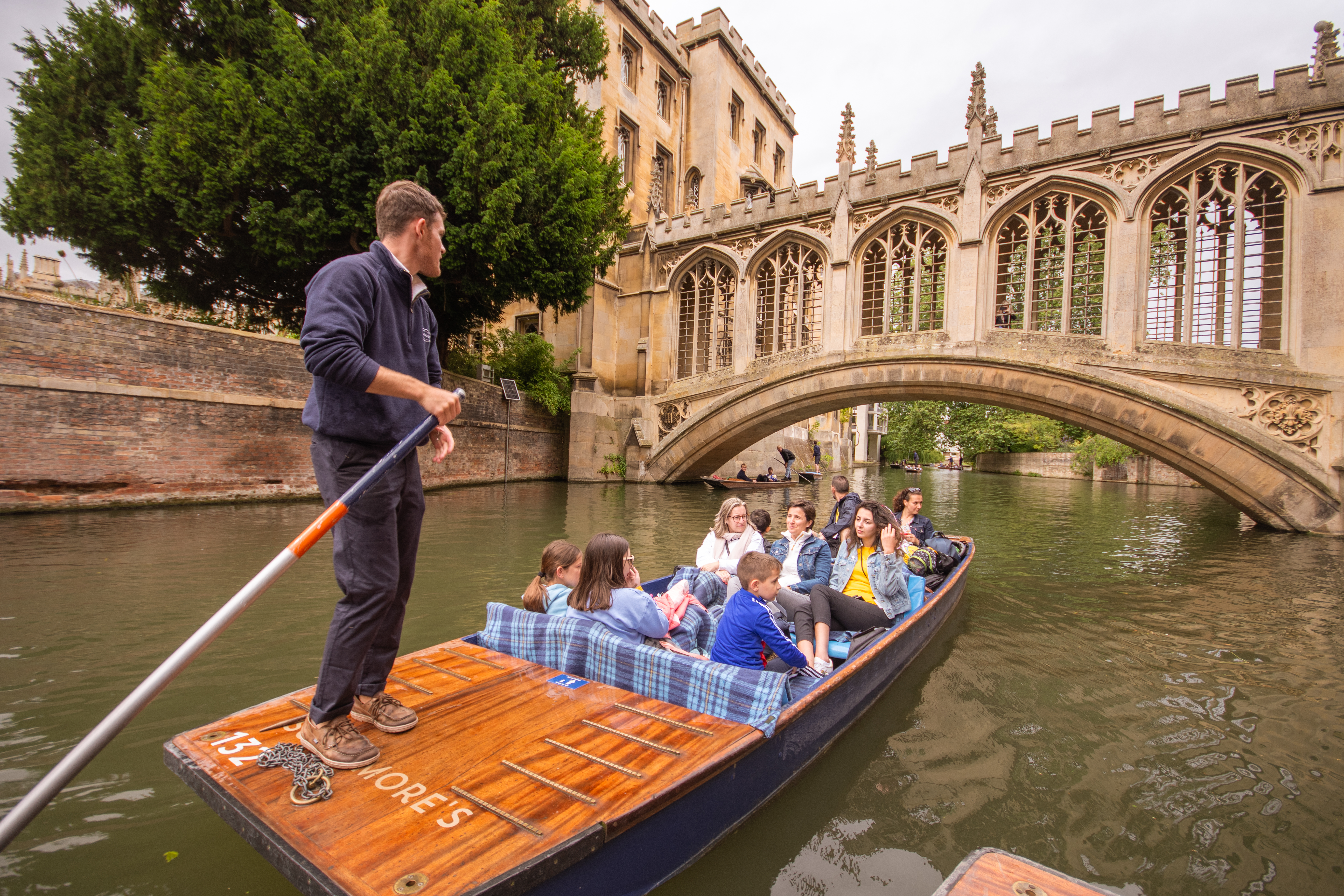A group of students punting in Cambridge