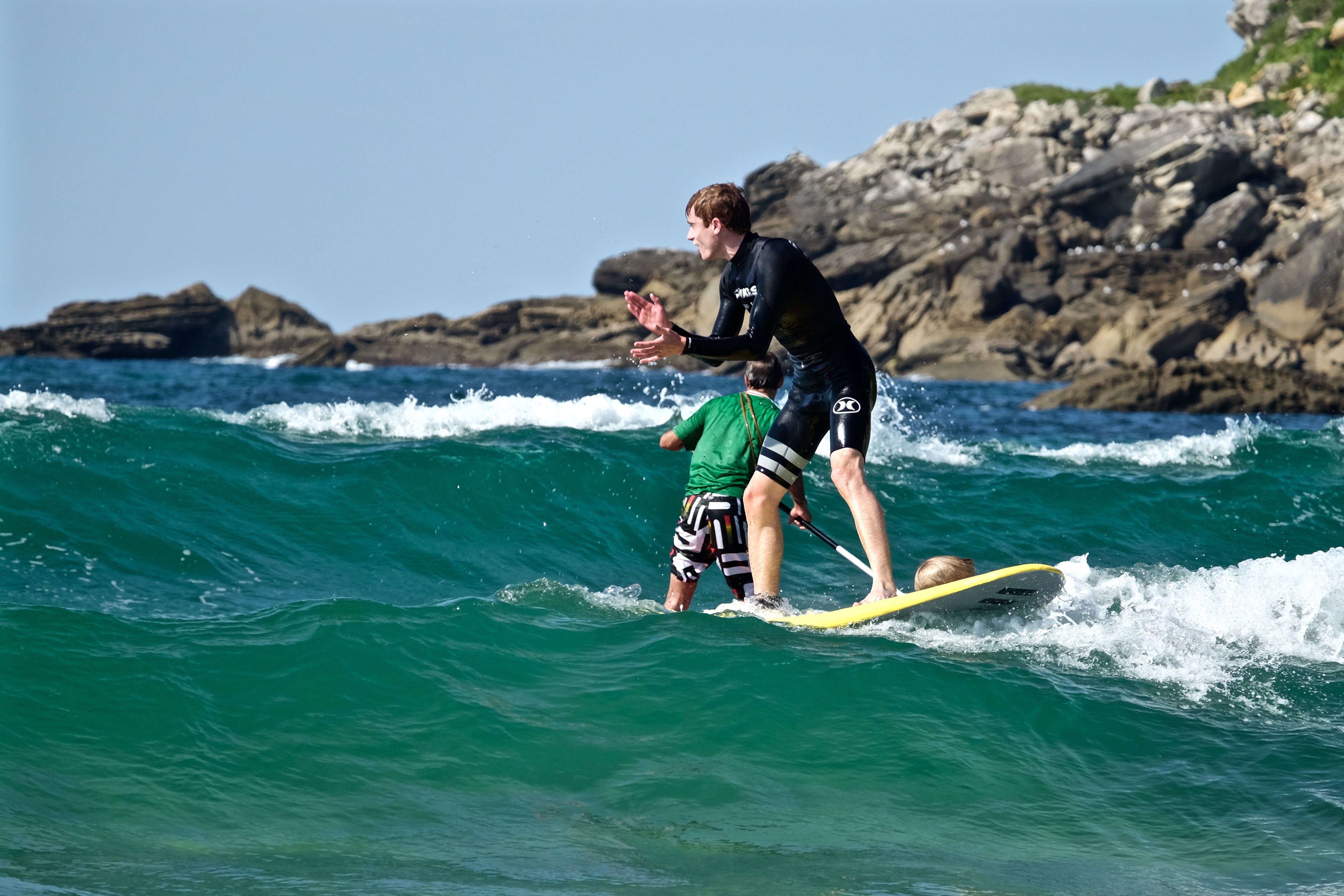Two students surfing