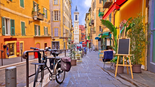 Nice colorful street architecture and church view in Nice, France