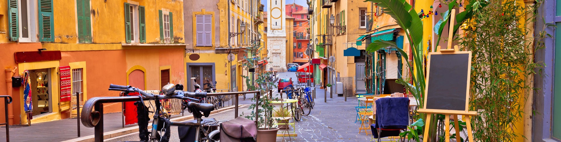 Nice colorful street architecture and church view in Nice, France
