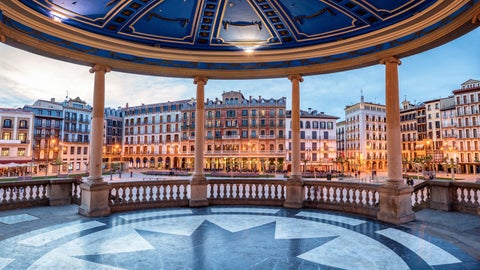 Circular bandstand in Plaza del Castillo, Pamplona, Spain, surrounded by historic buildings in the city center