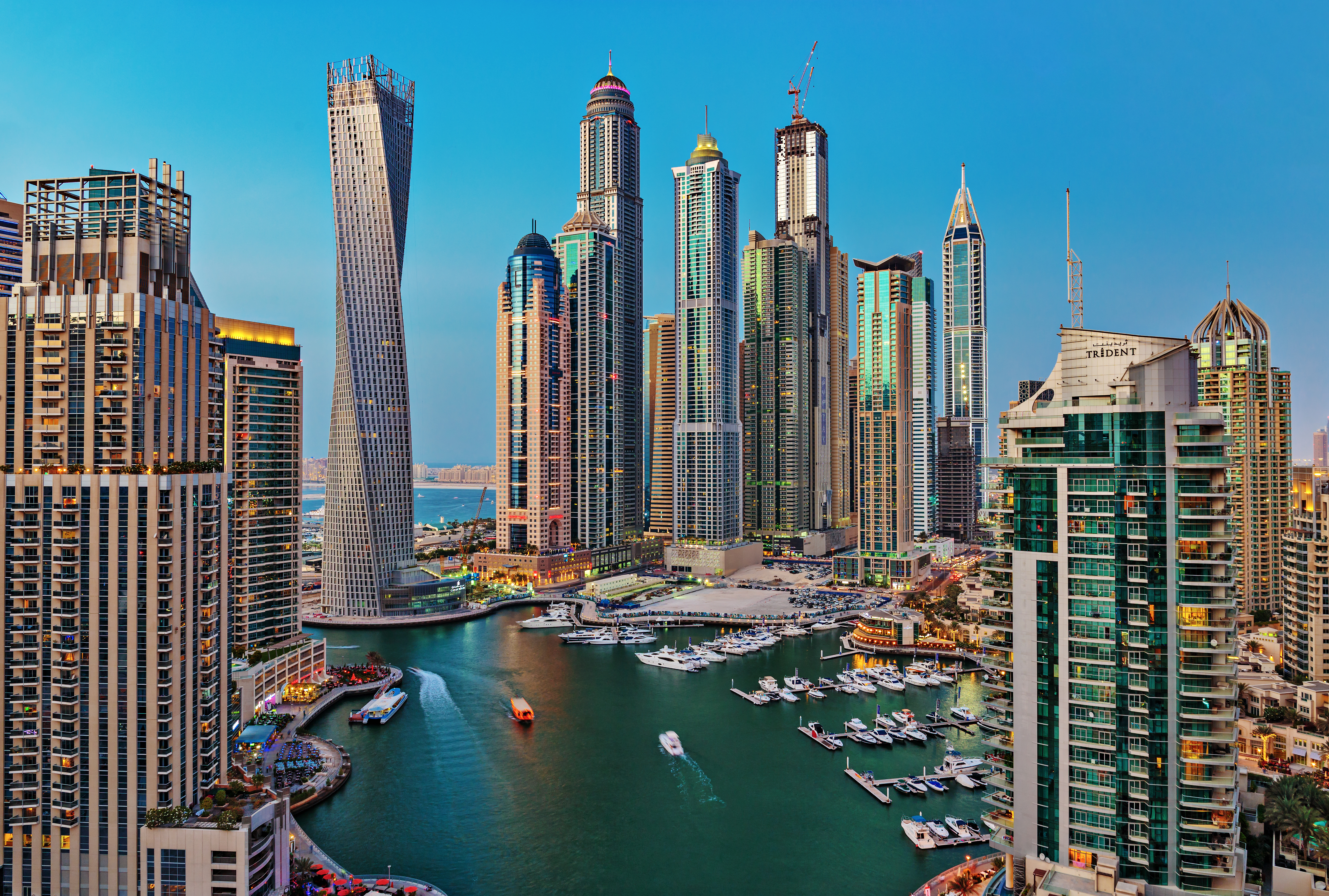 Twilight aerial view of Dubai Marina with yachts and boats on the Persian Gulf waters