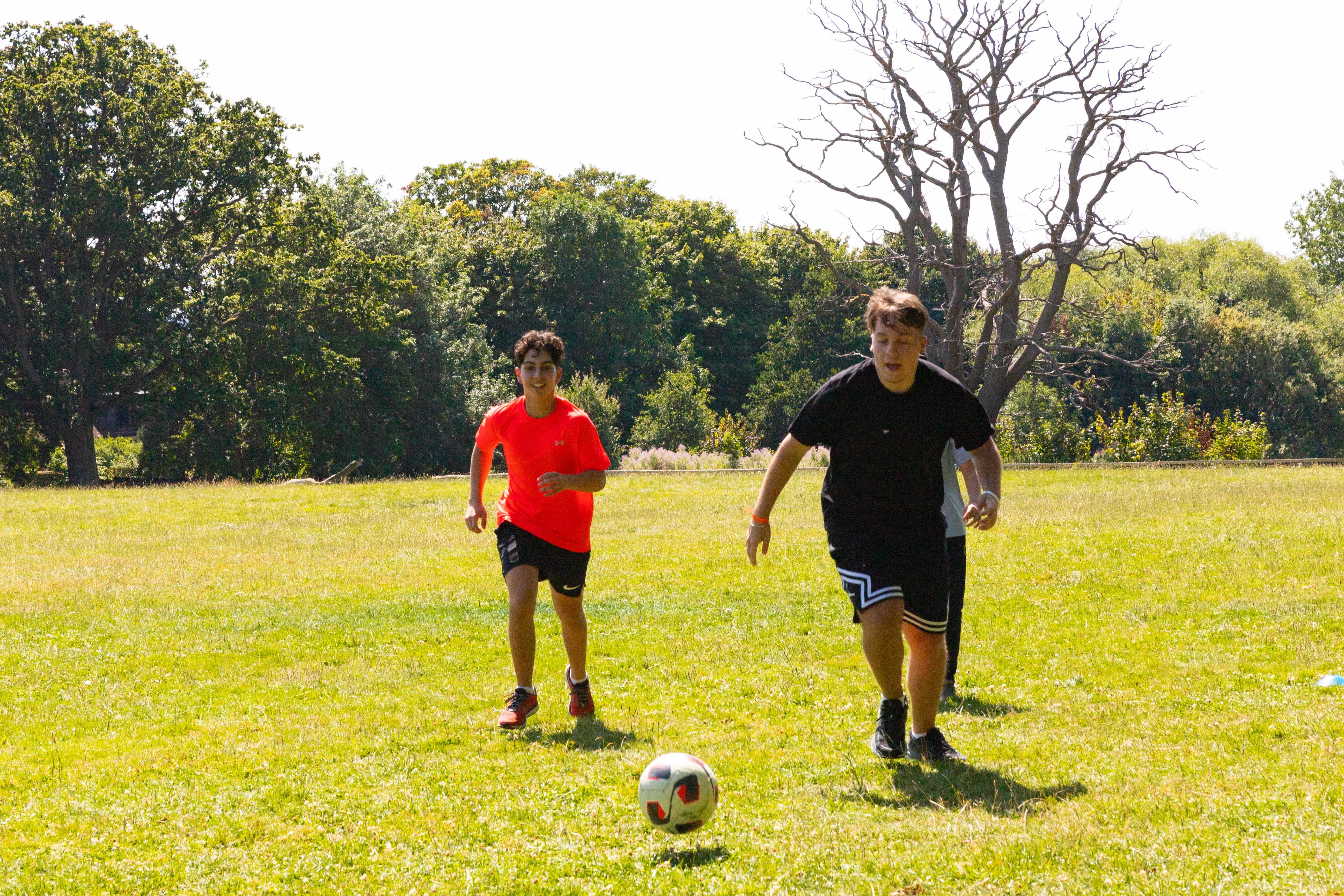 Students playing football at Oxford Brookes University