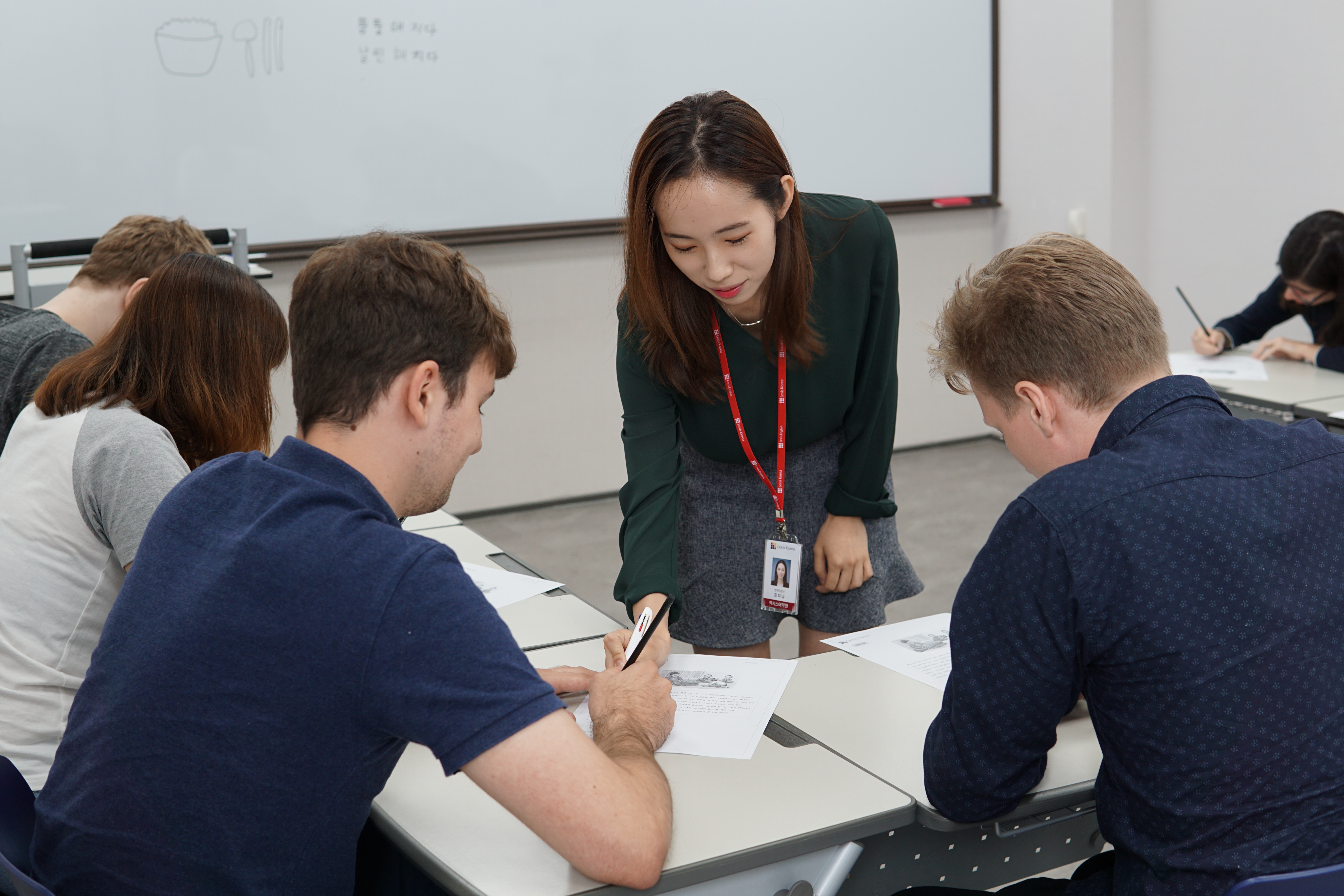 A teacher explaining a lesson in a class