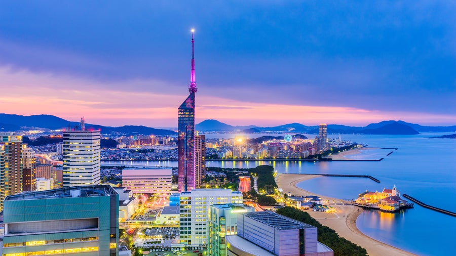 Panoramic view of Fukuoka skyline featuring Fukuoka Tower and Hakata Bay in Japan