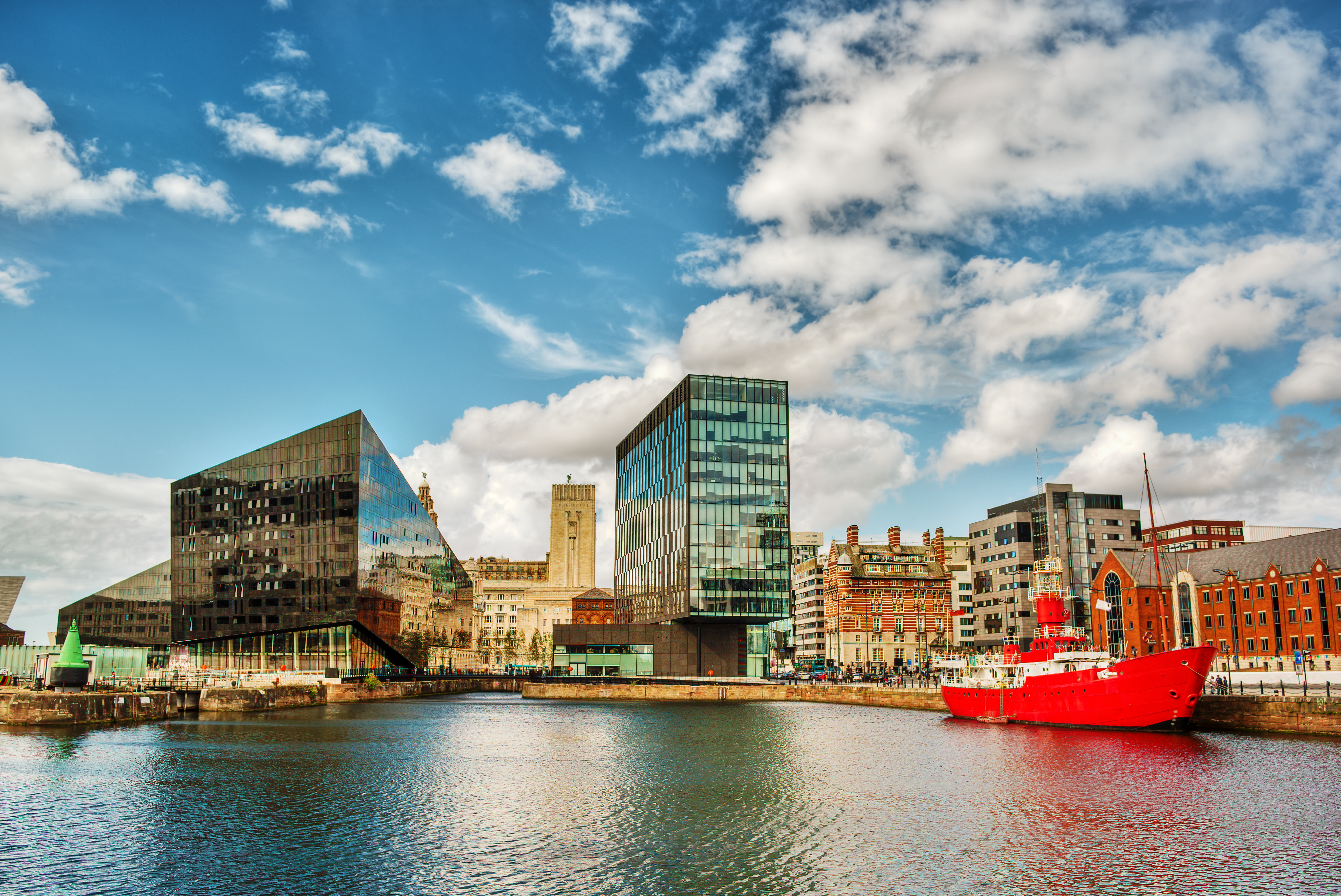 Albert Dock in Liverpool with historic warehouses and modern buildings along the waterfront