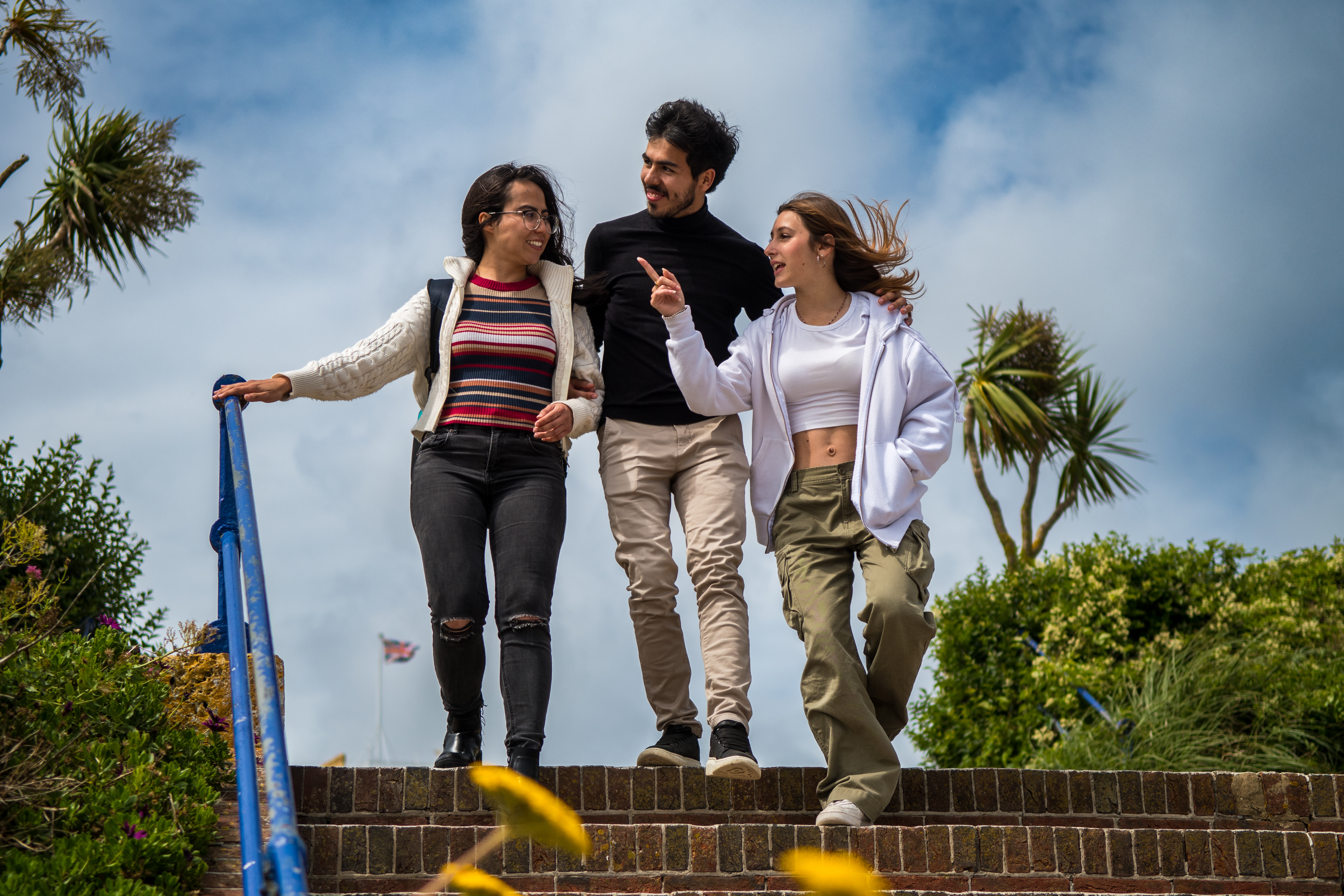 Three students walking around Eastbourne