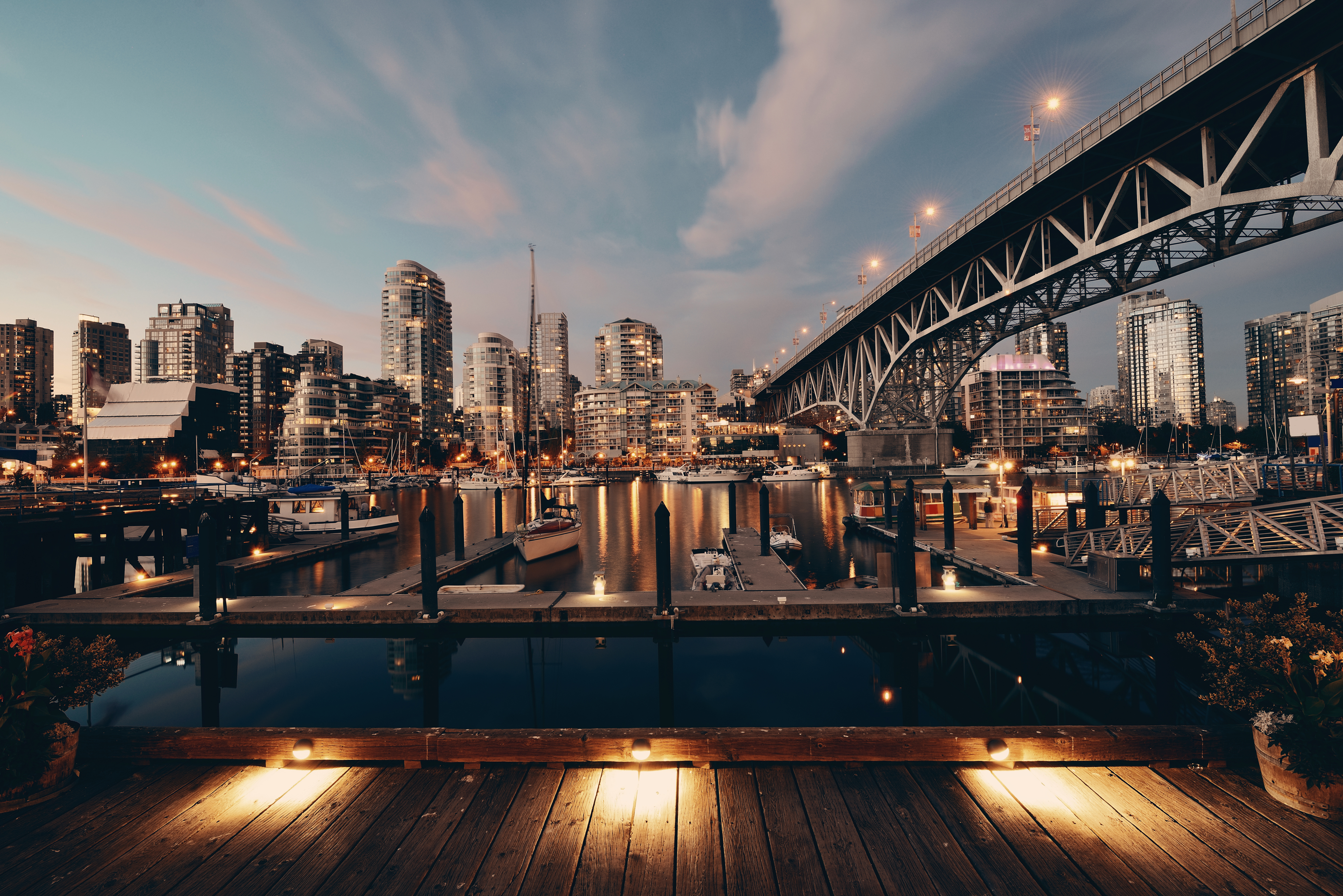 Vancouver City center and its modern buildings and bridge across Fraser River at night