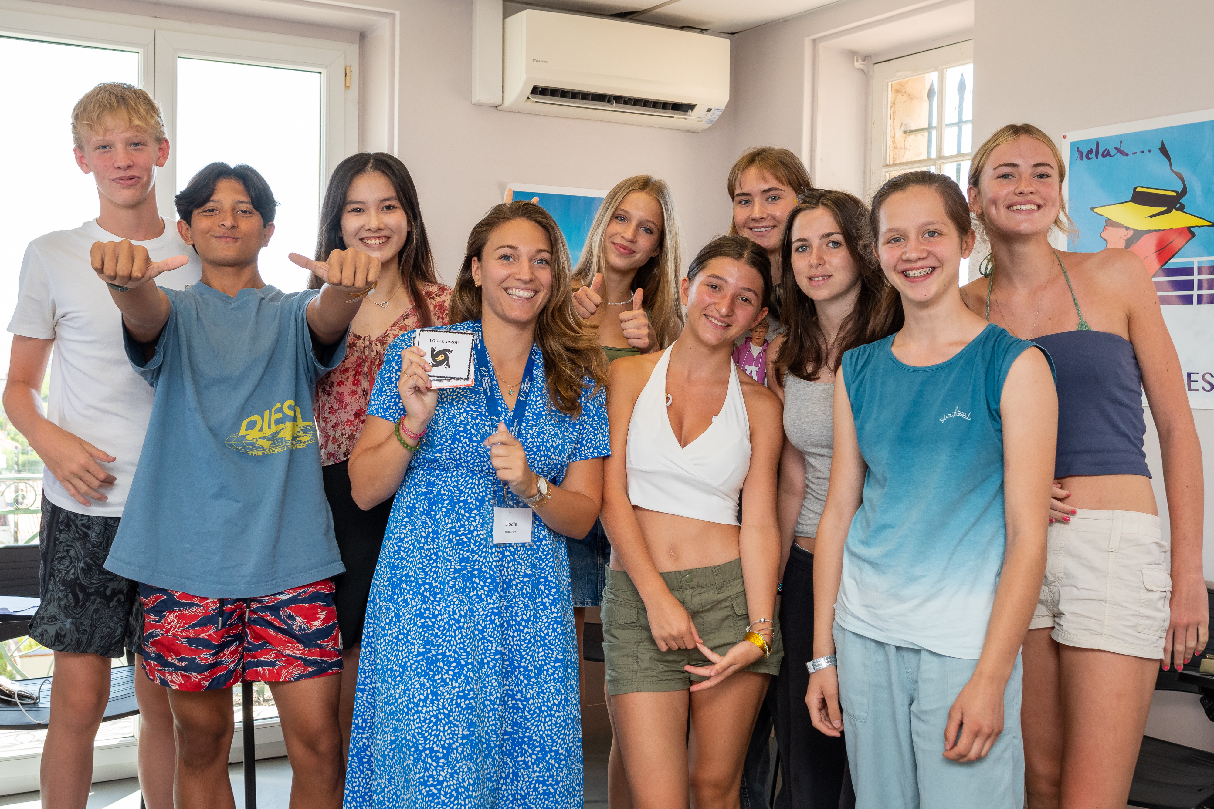 Students with teacher and certificate