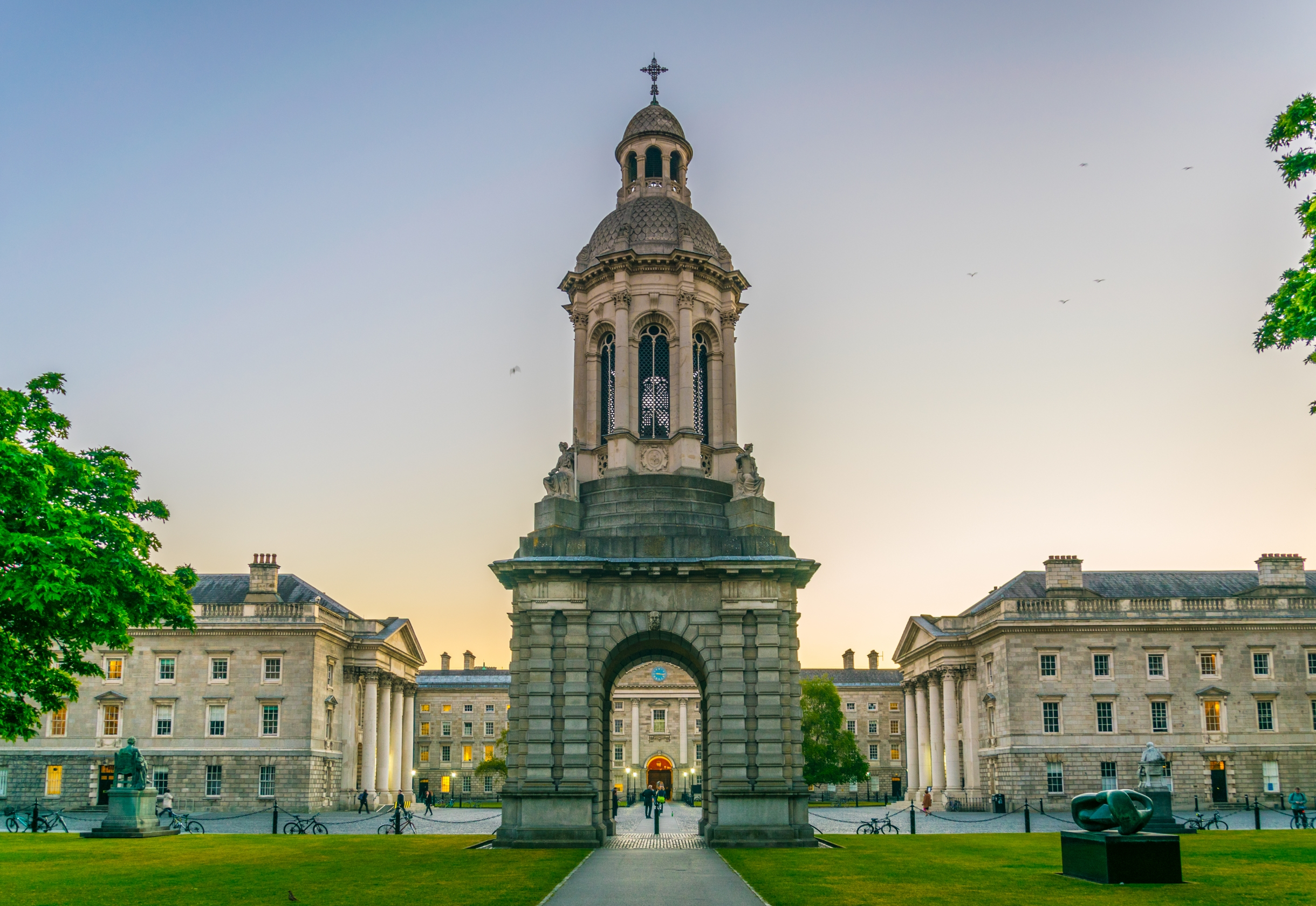 Trinity College Dublin at sunset in spring with historic buildings and blooming trees