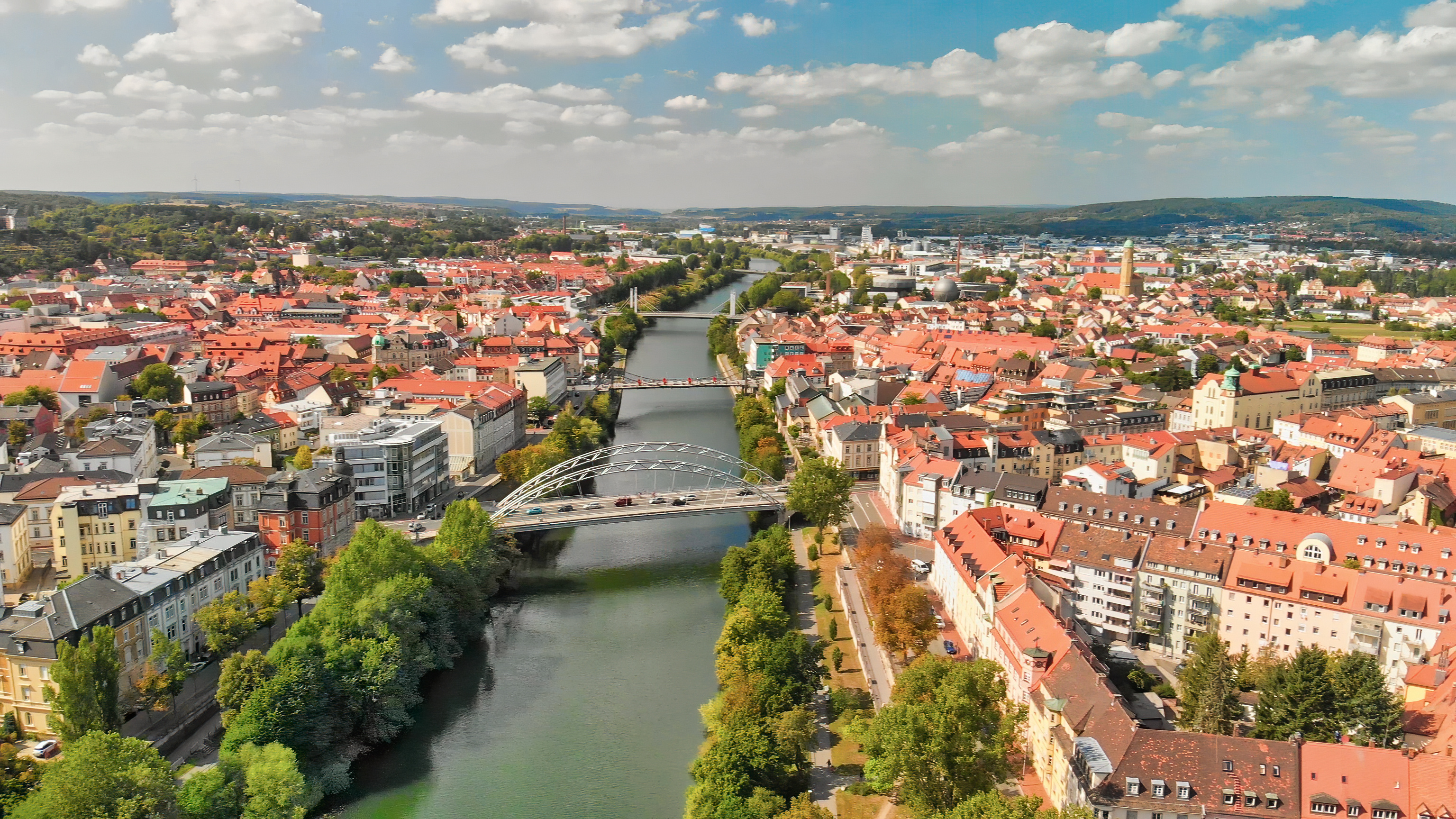 Aerial view of Bamberg, Germany, featuring Altes Rathaus (Old Town Hall) on the Obere Brücke (Upper Bridge) which spans the Regnitz River