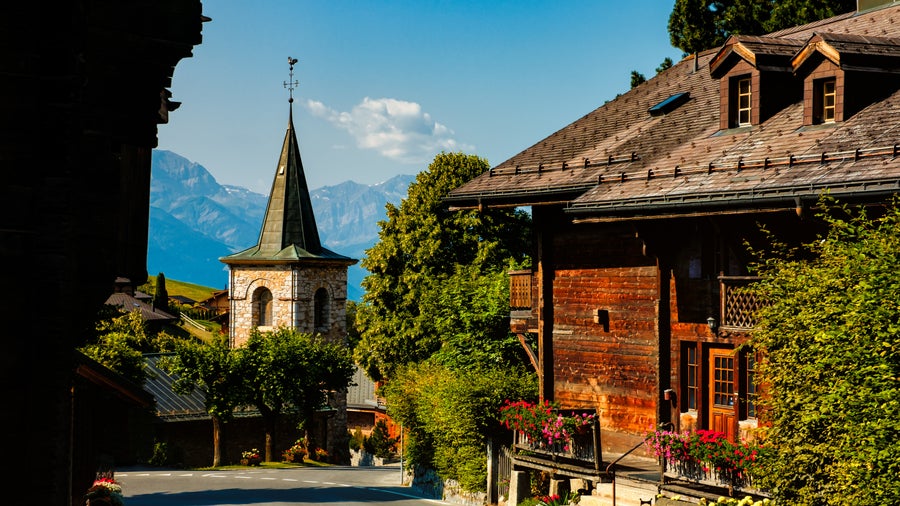 Street view in the picturesque municipality of Leysin, canton of Vaud near Aigle, Switzerland, on a bright sunny summer day with clear blue skies