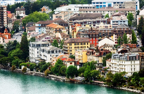 Sunny summer morning view of Montreux city in Switzerland from the embankment along Lake Geneva