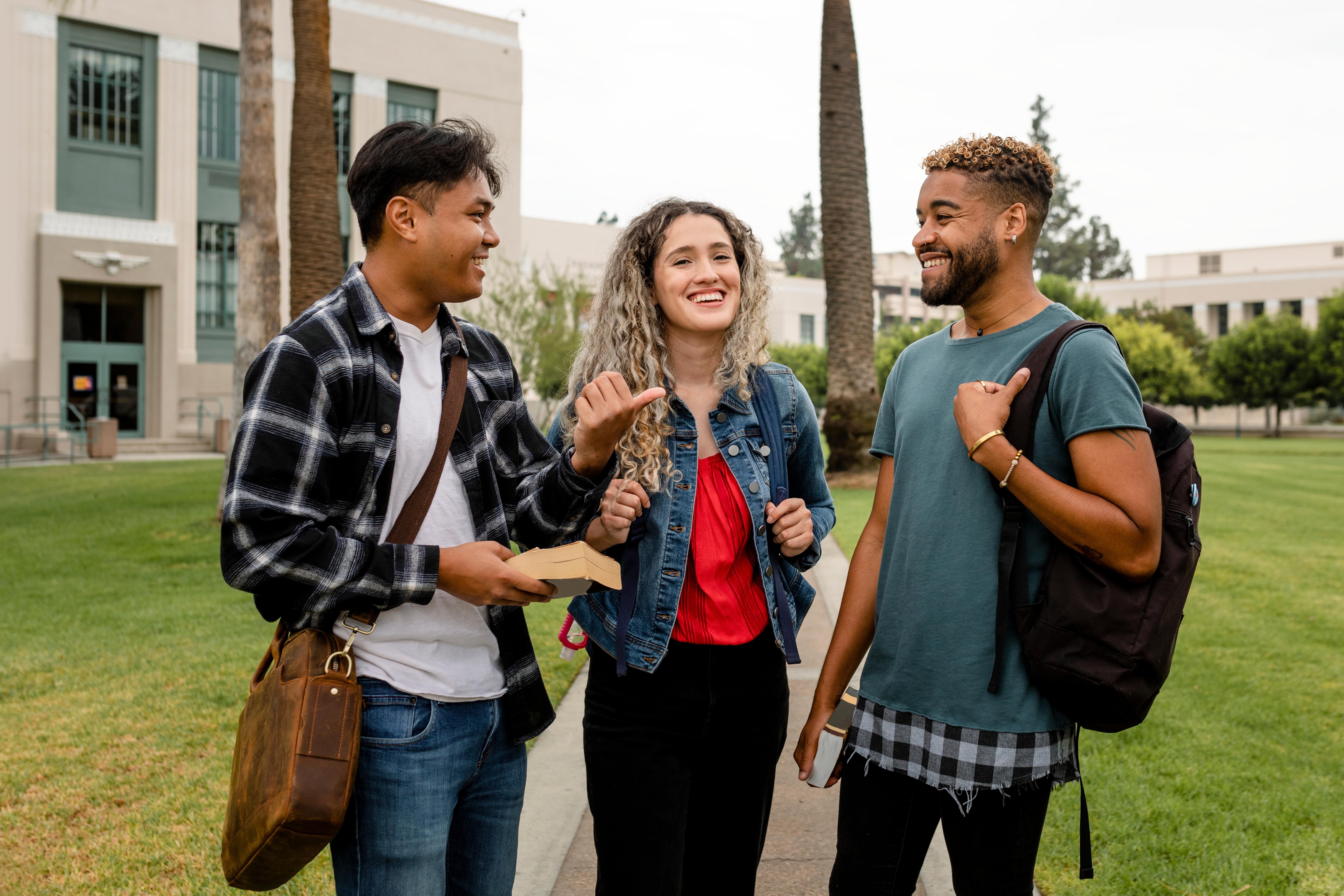Students chatting and talking together on campus grounds