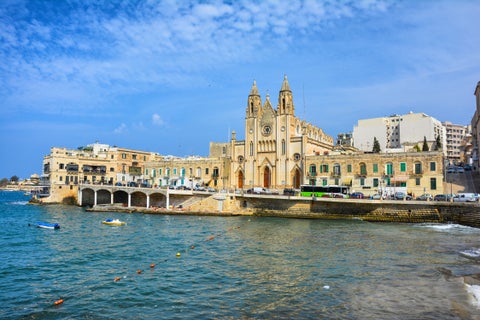 San Giuliano featuring a coastal scene with historic buildings, serene waters in Milan, Italy