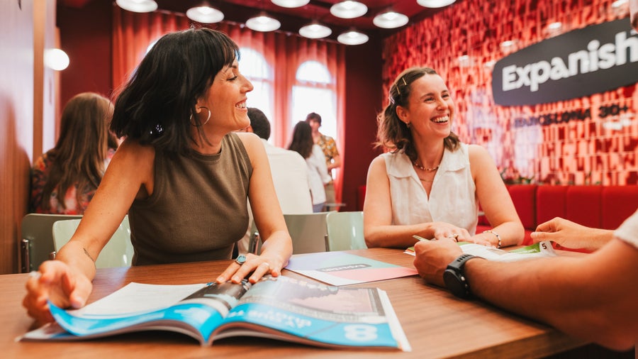 Two students sitting in the common room