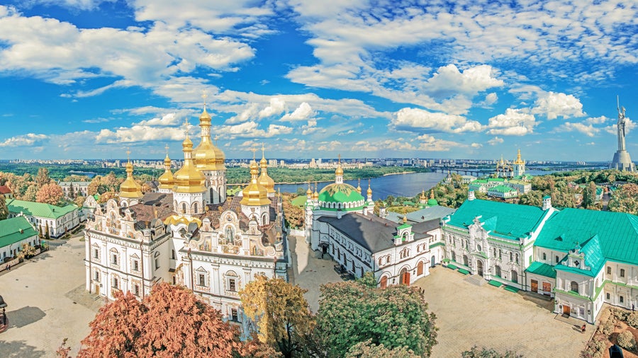 Aerial view of Kiev, Ukraine, featuring Saint Sophia’s Cathedral, other historic buildings, and bustling city life