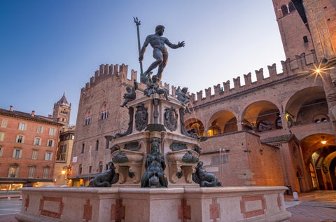 Fontana di Nettuno or Neptune fountain on Piazza Maggiore square at the morning dusk